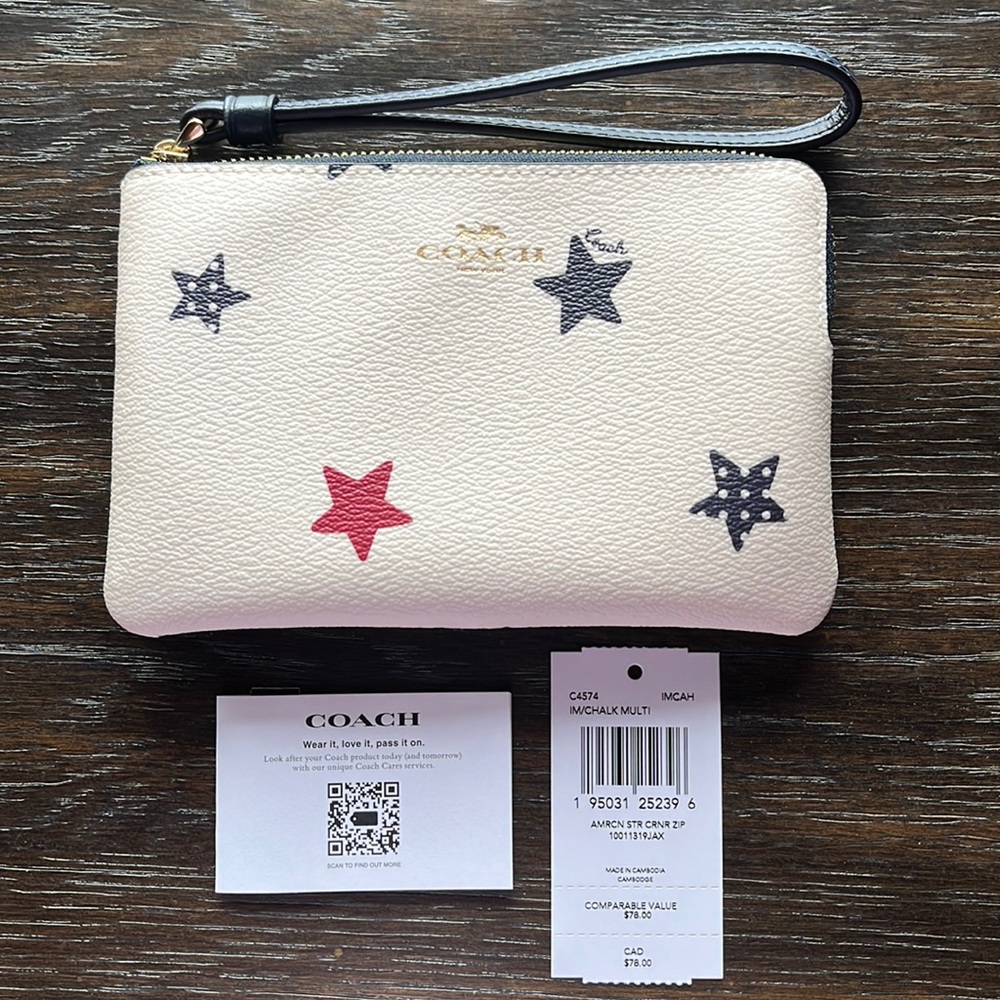 NWT. Coach Corner zip wristlet with American star print$65